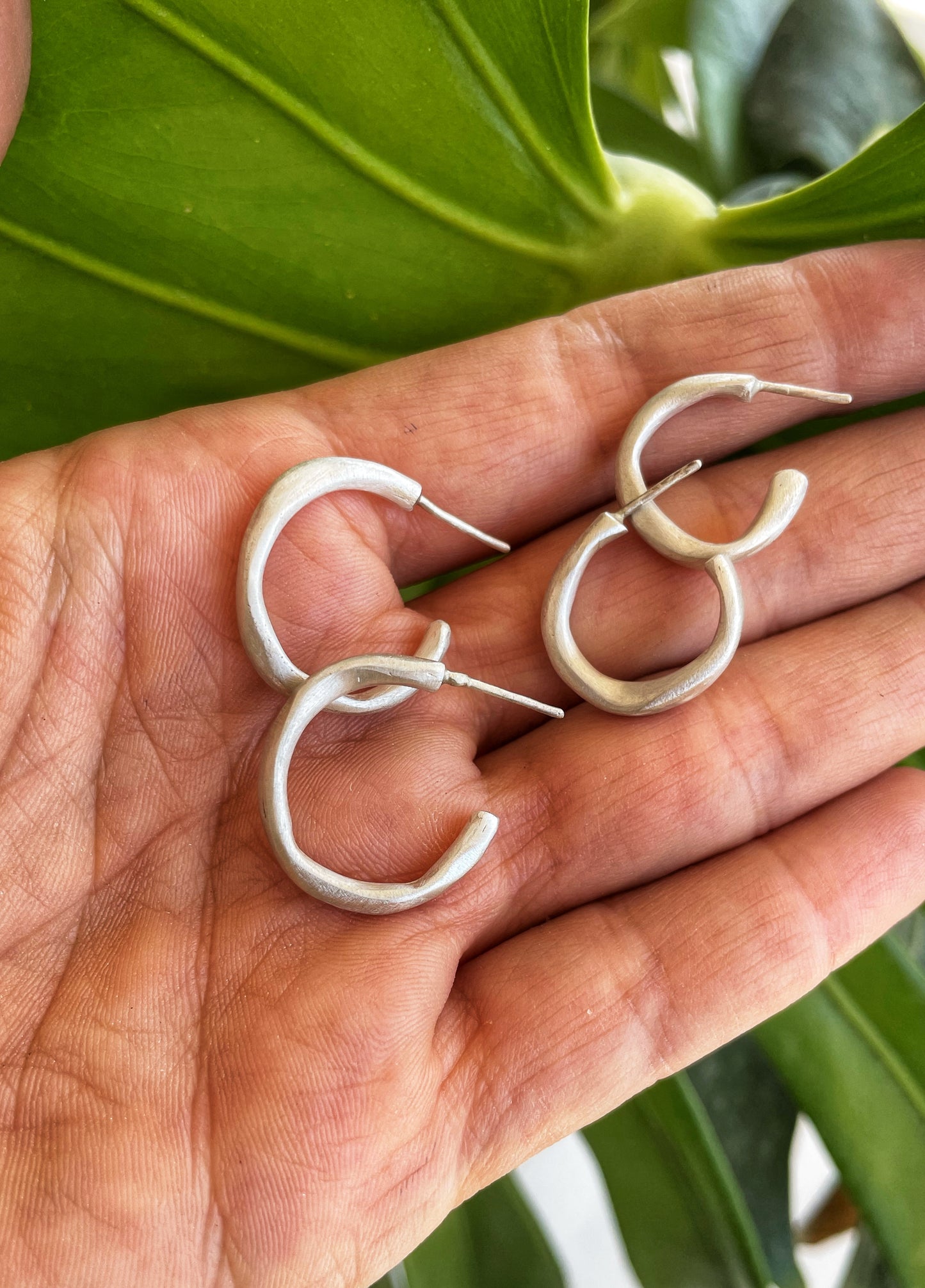Irregular silver hoops