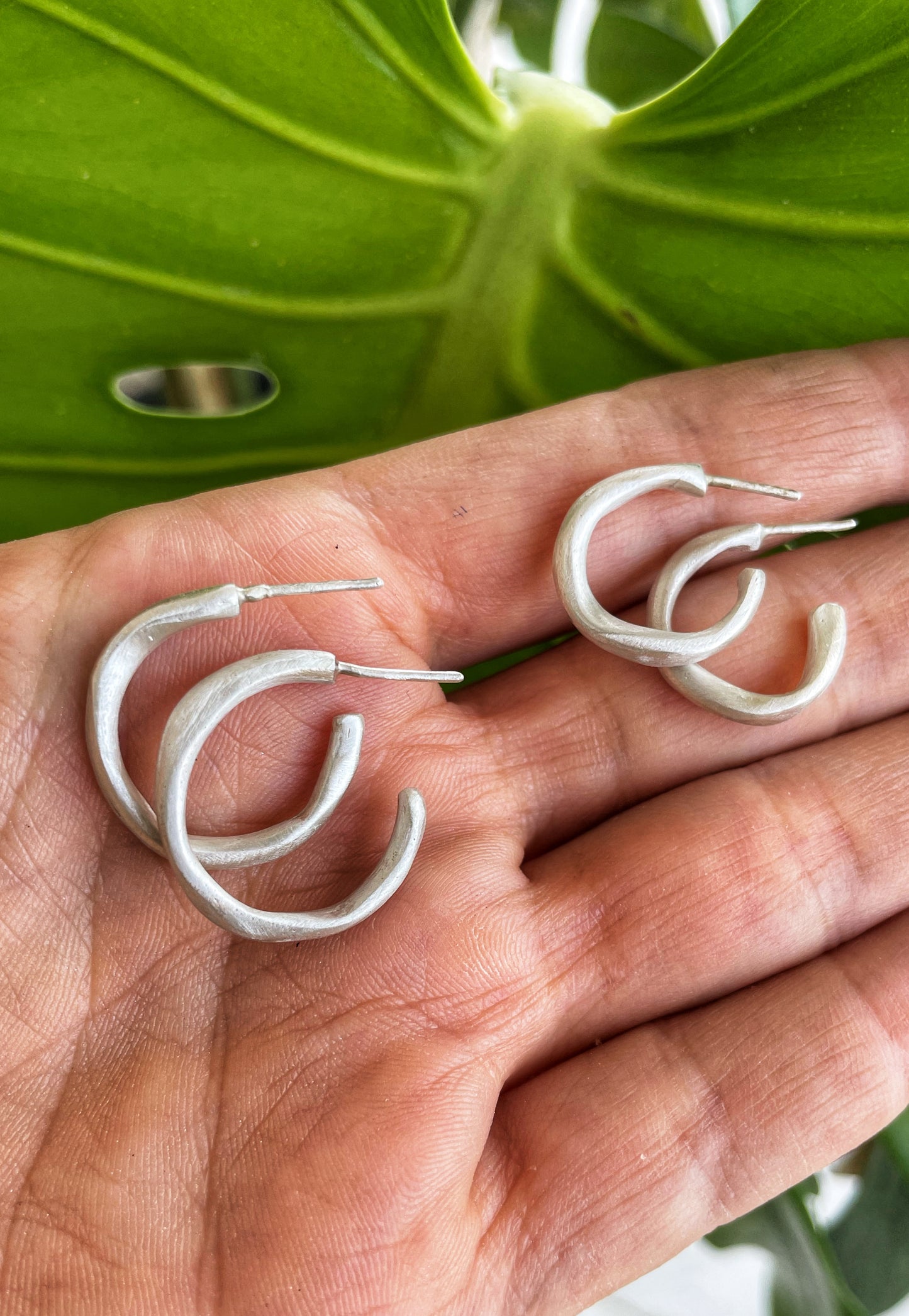 Irregular silver hoops