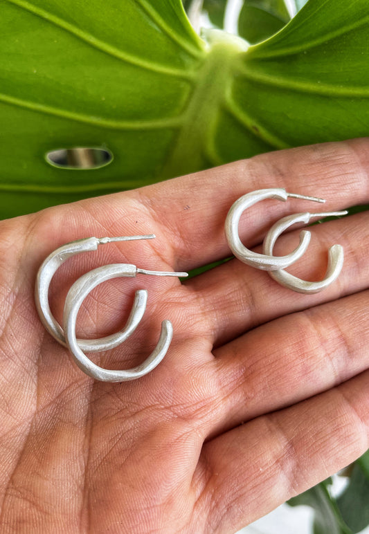 Irregular silver hoops