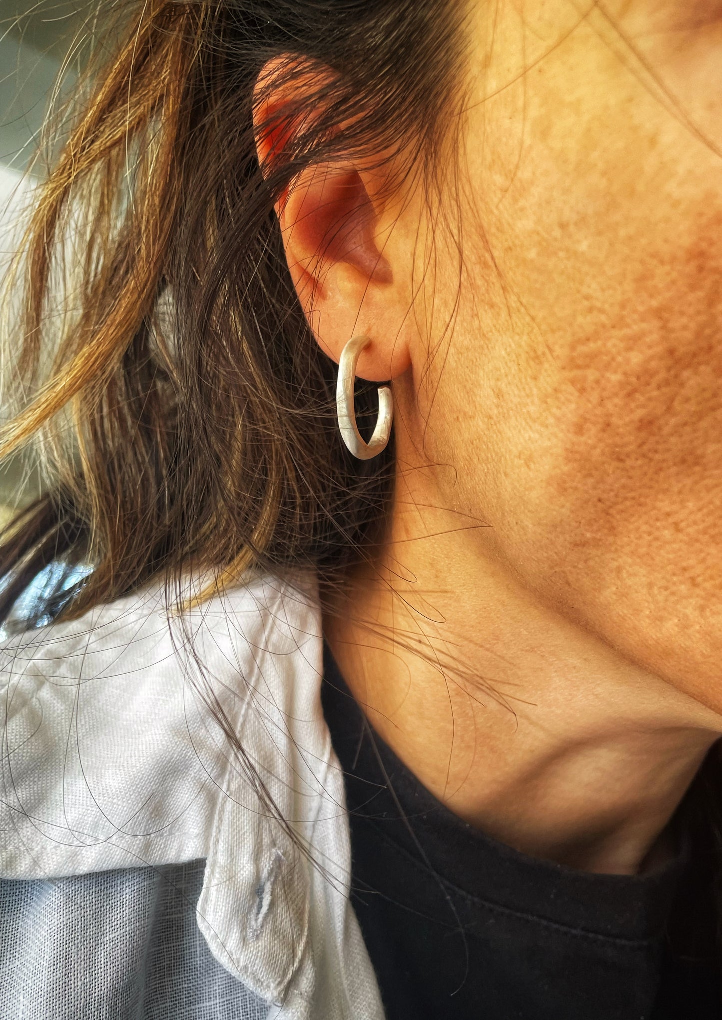 Irregular silver hoops