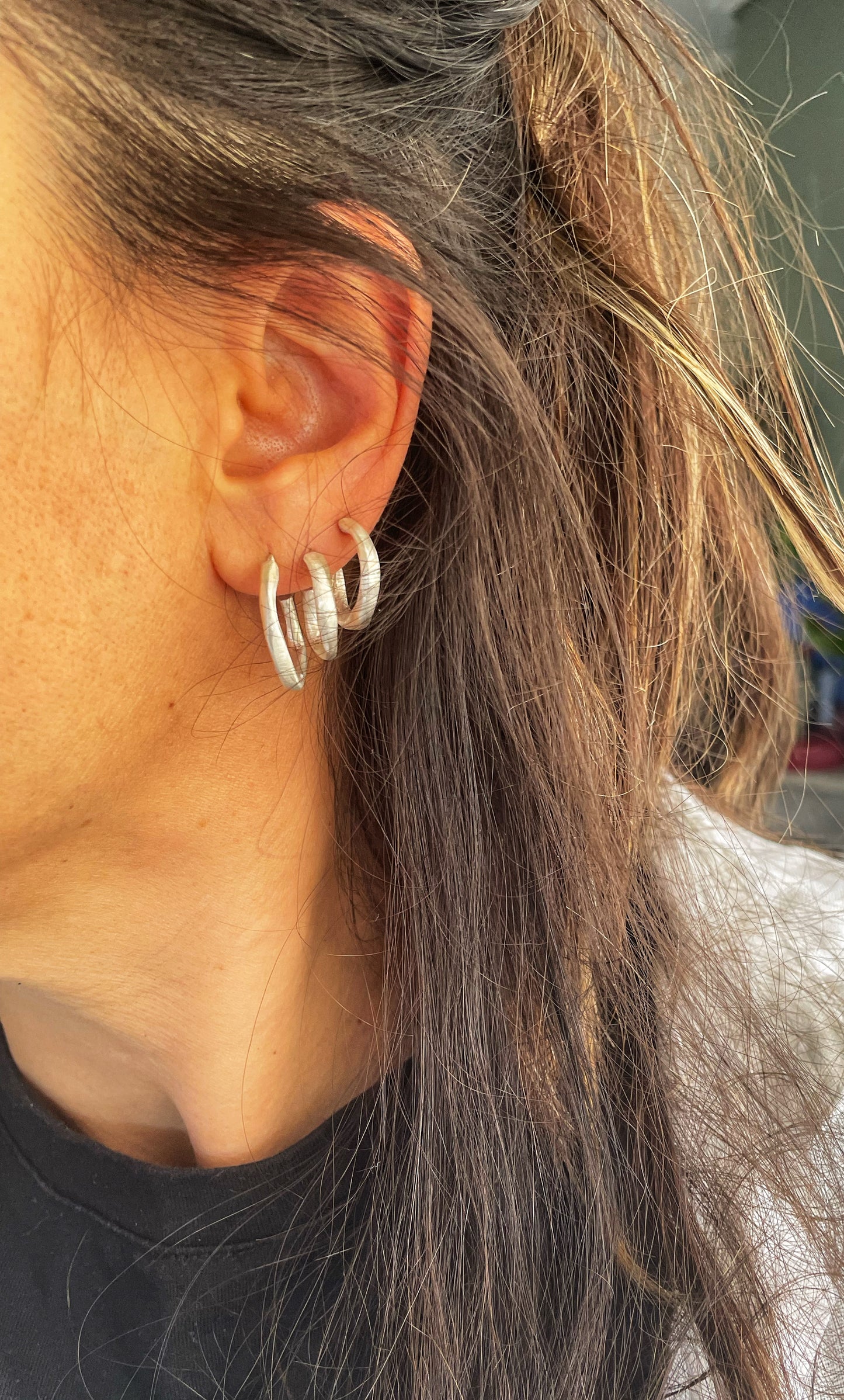 Irregular silver hoops