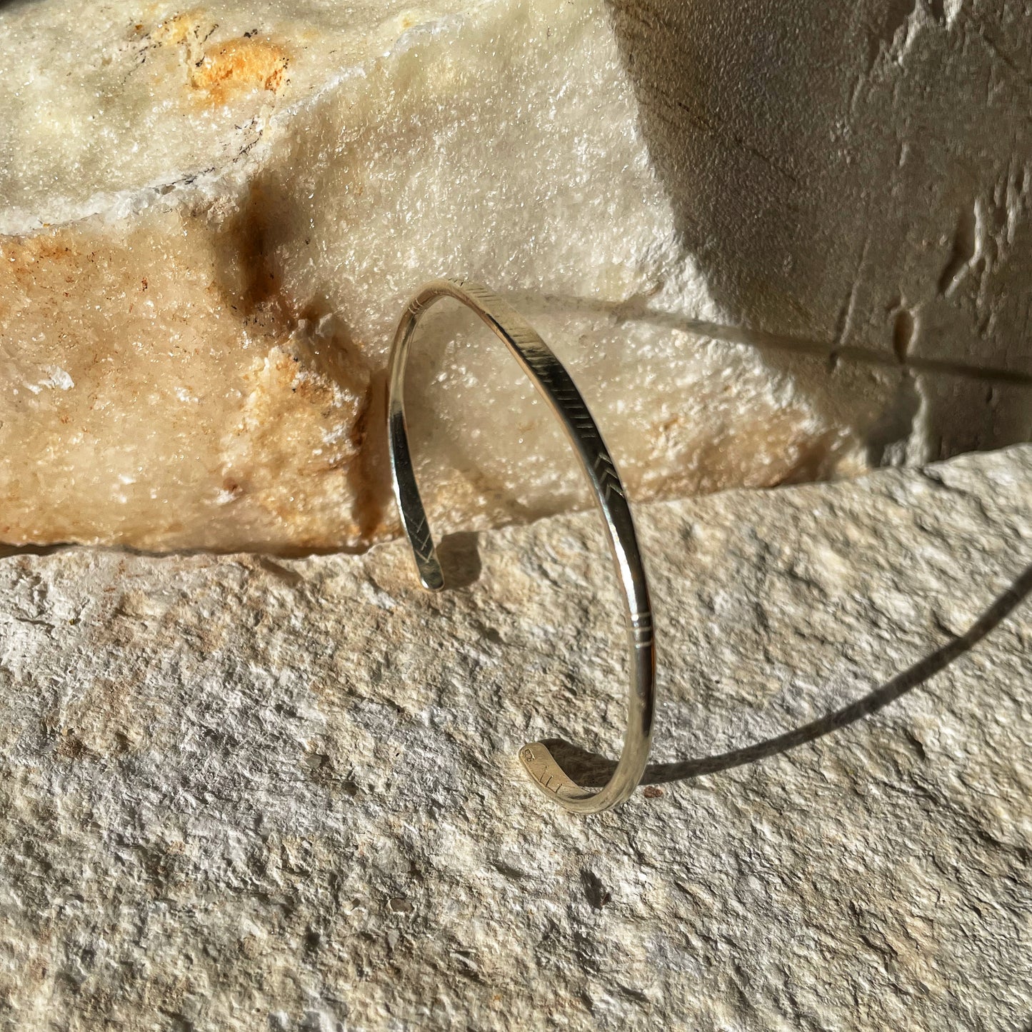 Engraved open silver bangle