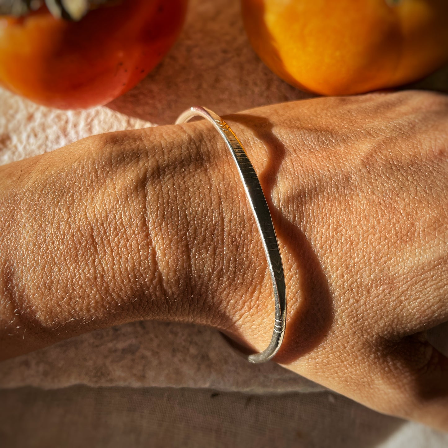 Engraved open silver bangle