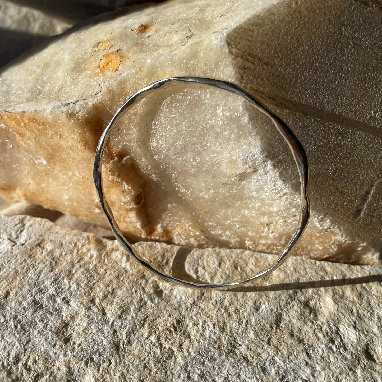 Raw silver bracelet